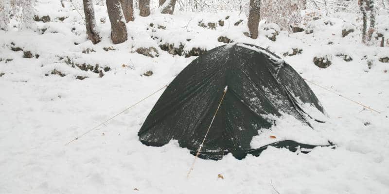 Camping in Winter How To Handle A Snowstorm While Camping Feature Image